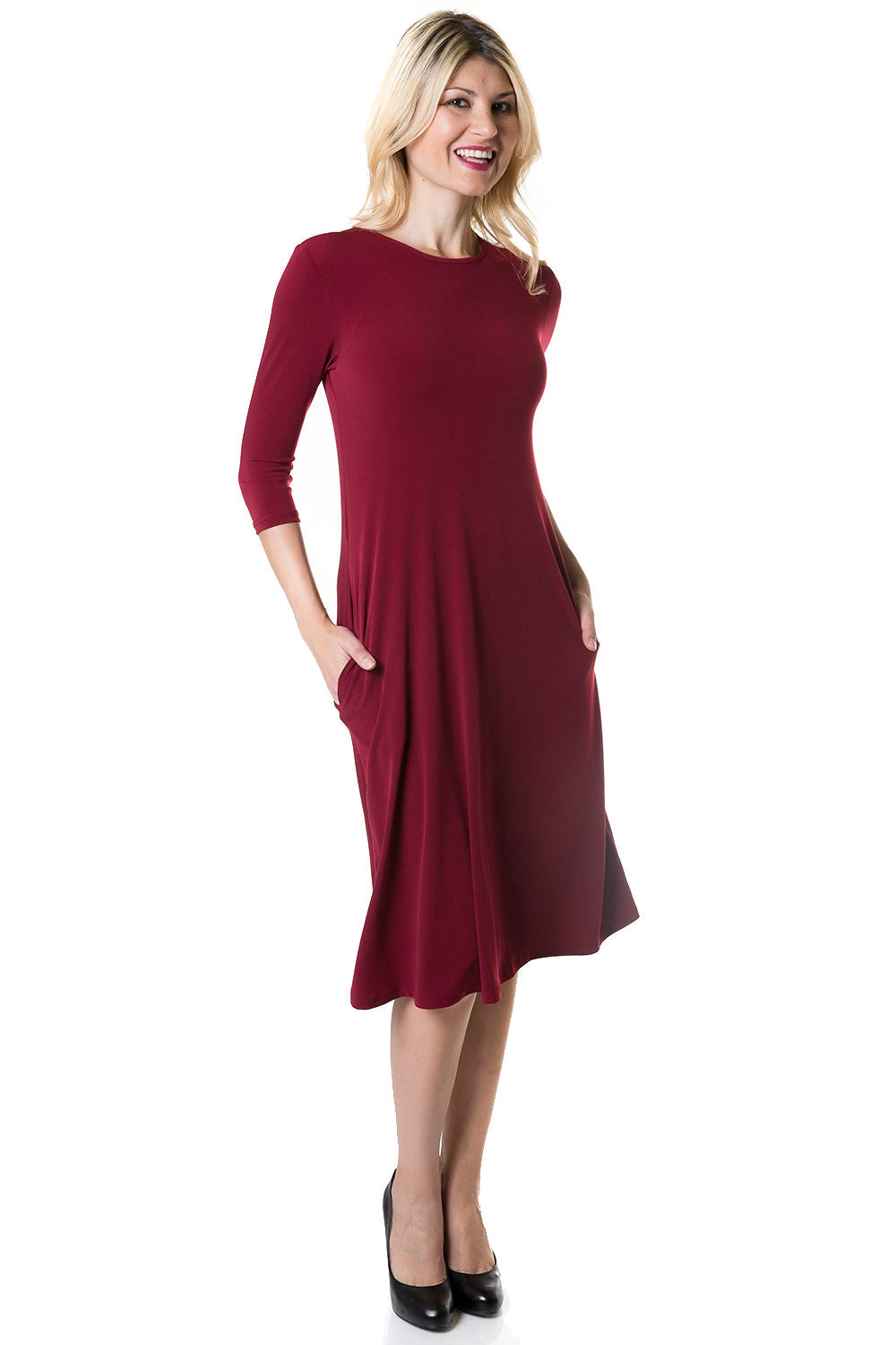 woman wearing burgandy flary 3/4 sleeve knee length modest dress