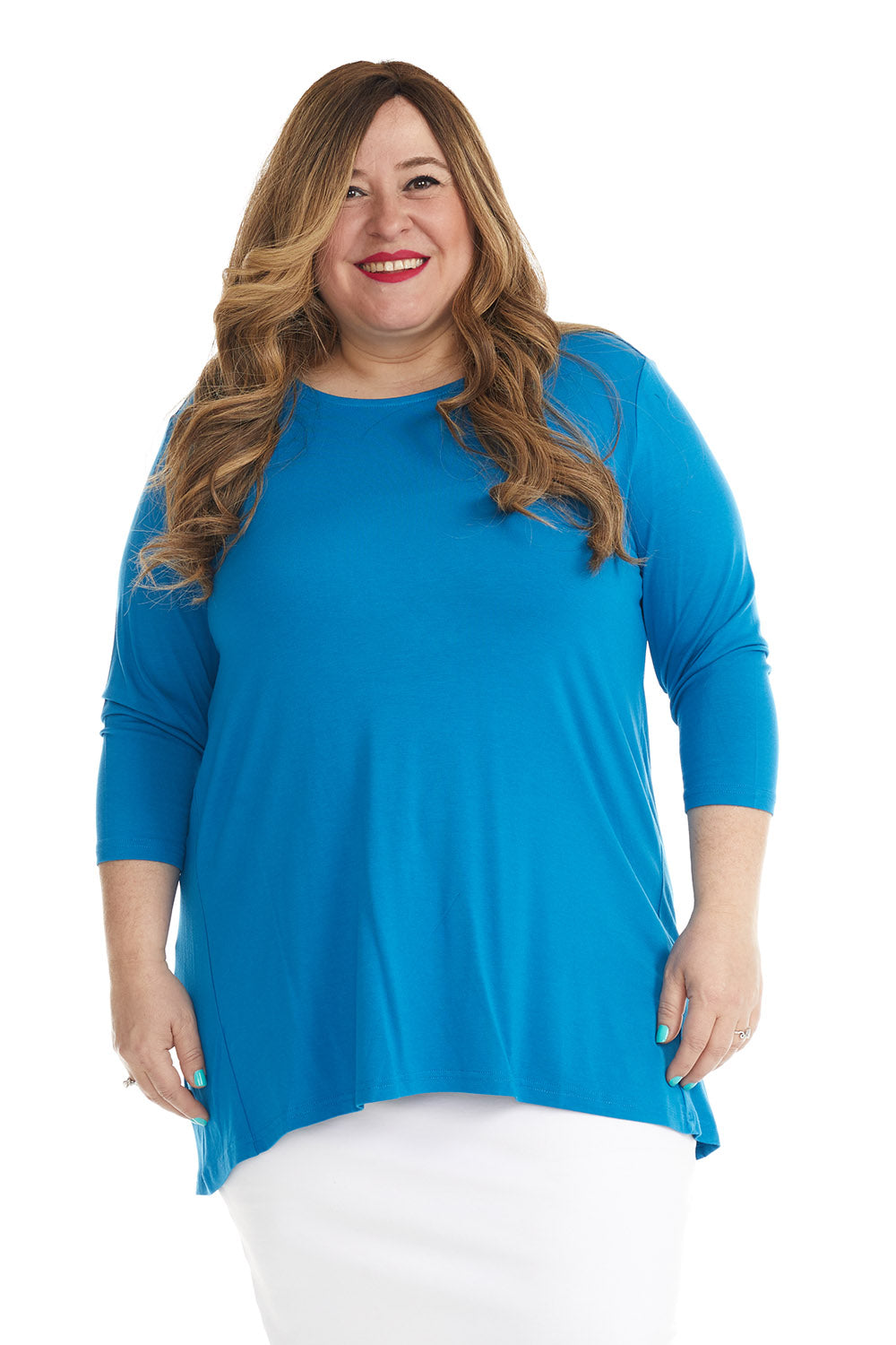 plus size woman wearing a blue basic tznius flattering loose tunic plus size shirt