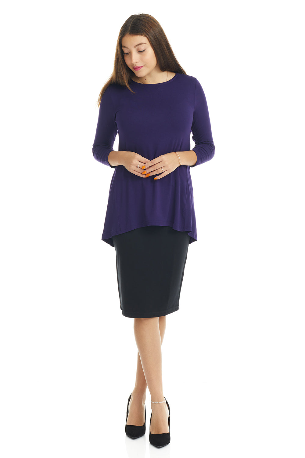 woman wearing a purple basic tznius flattering loose tunic plus size shirt