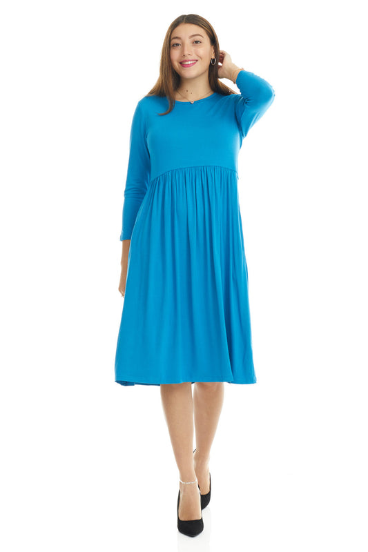 woman wearing a modest blue 3/4 sleeve knee length dress