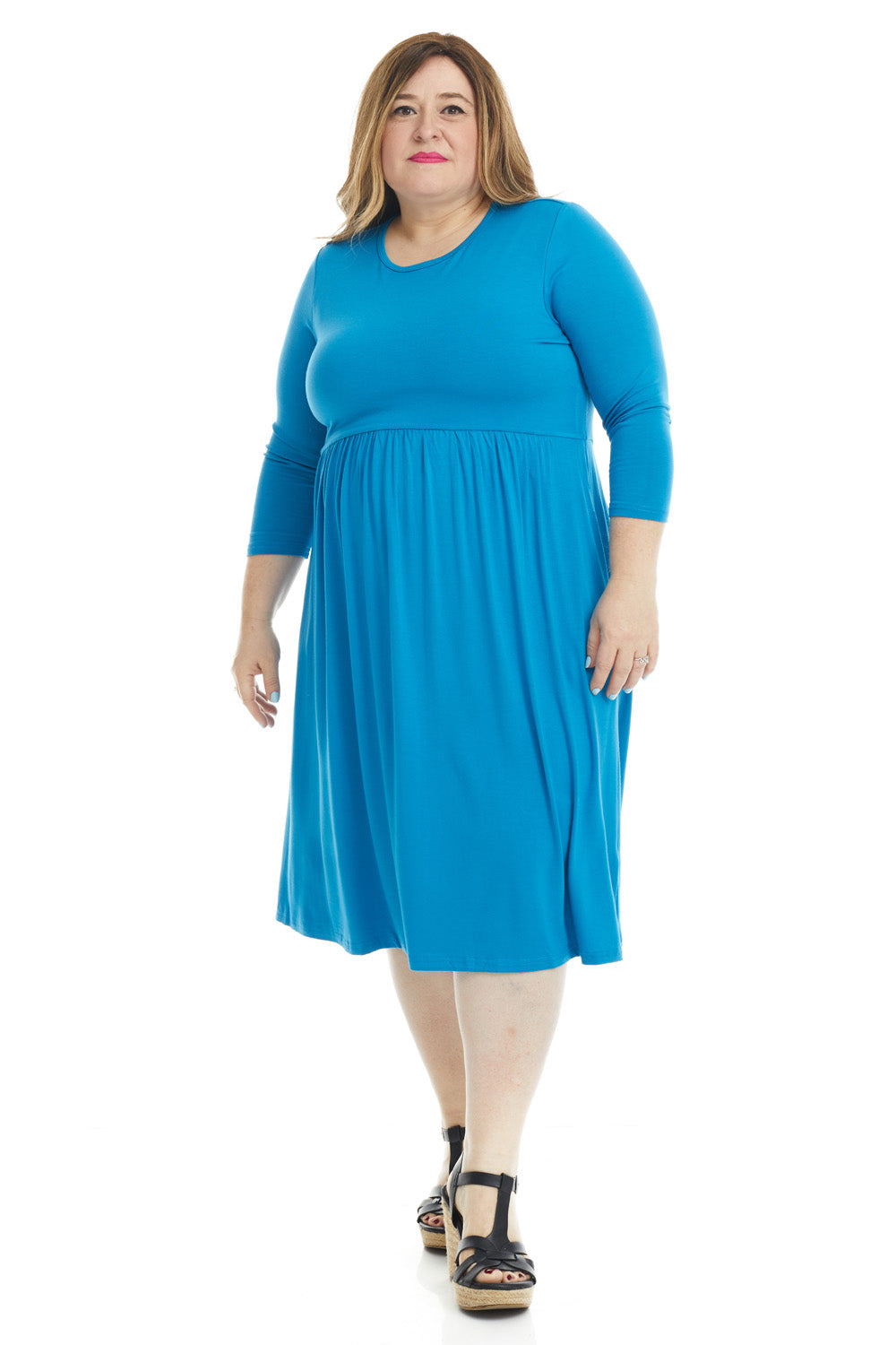 plus size woman wearing a modest blue 3/4 sleeve knee length dress