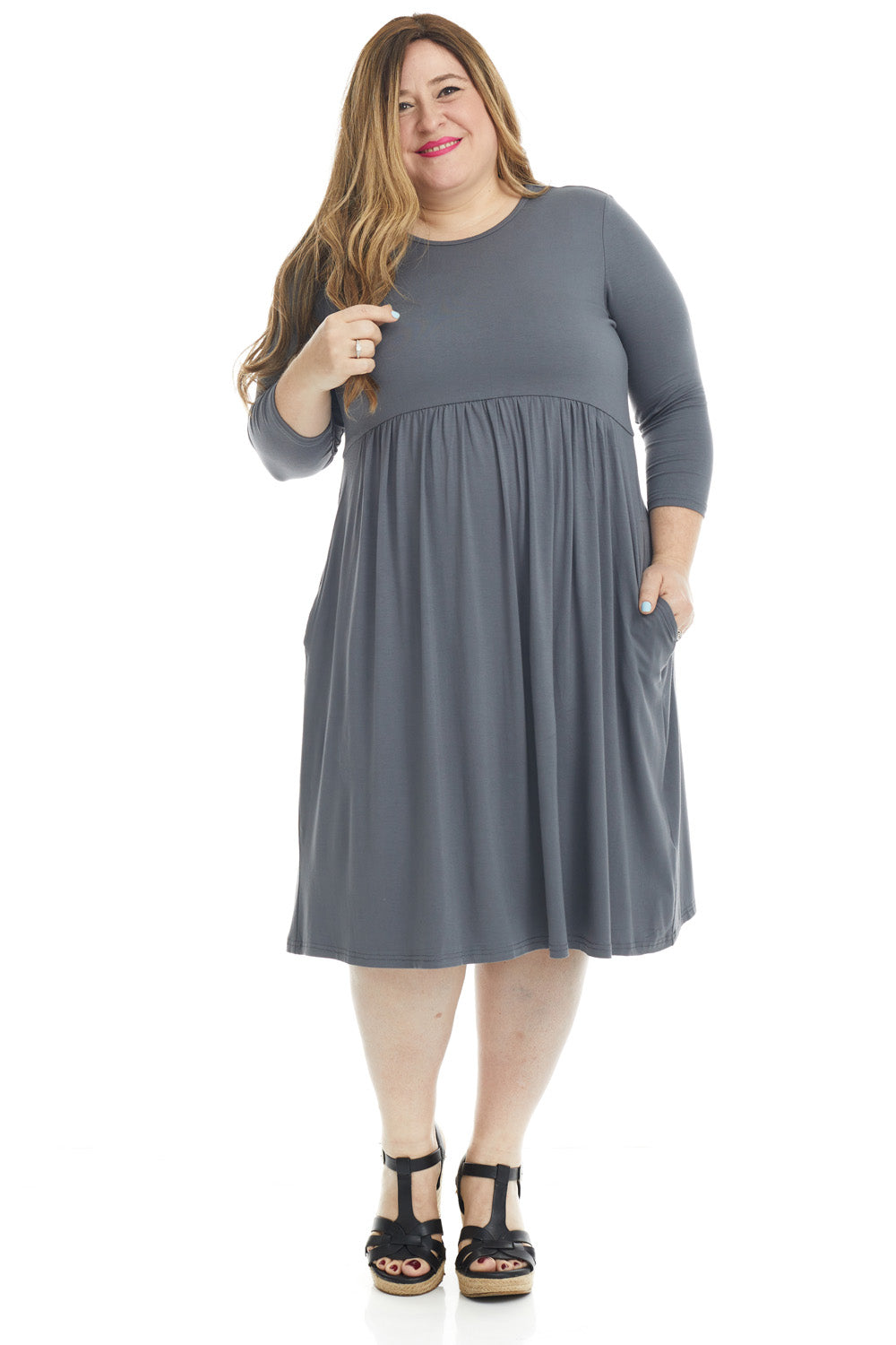 plus size woman wearing a modest dark grey gray 3/4 sleeve knee length dress