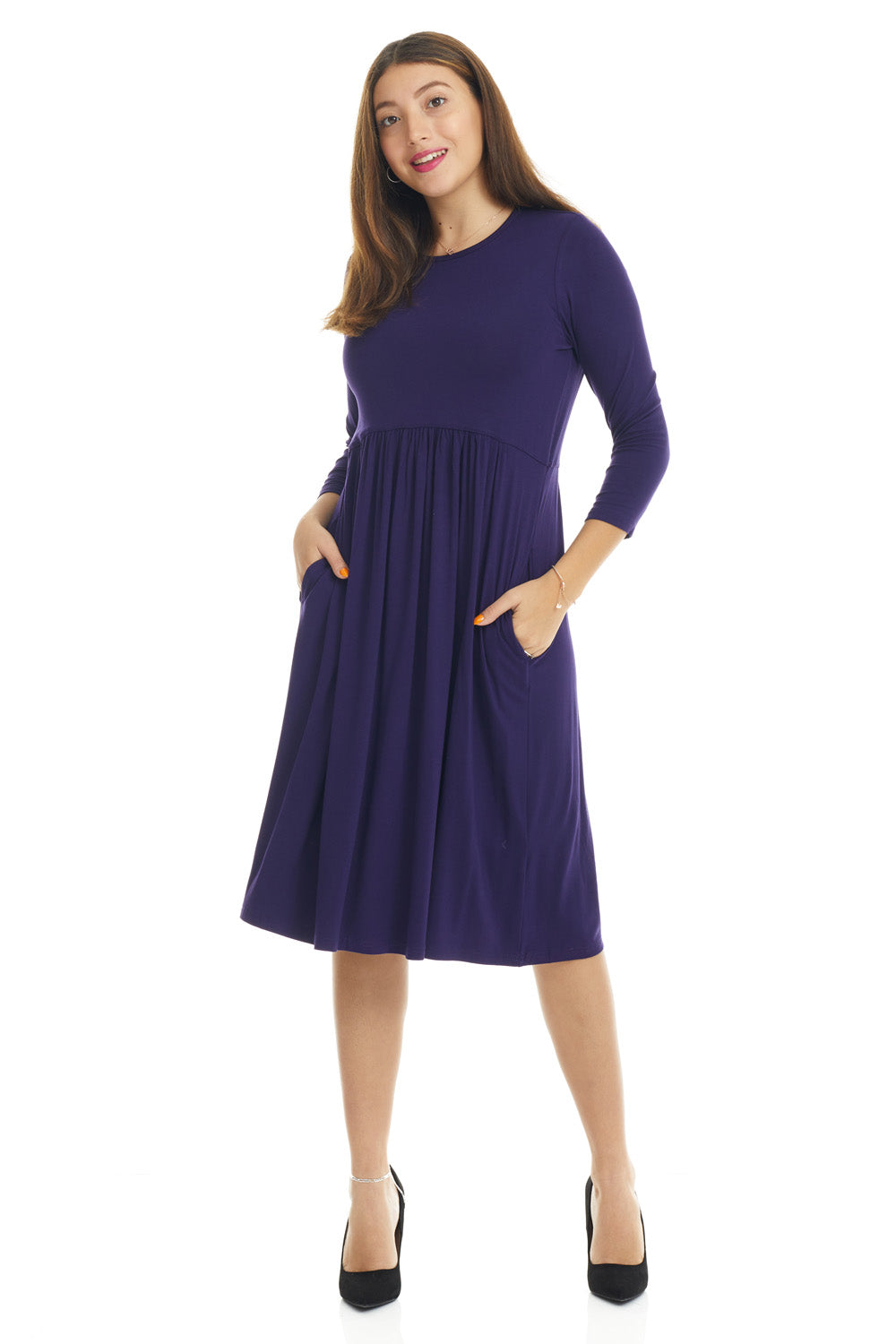 woman wearing a modest navy blue 3/4 sleeve knee length dress