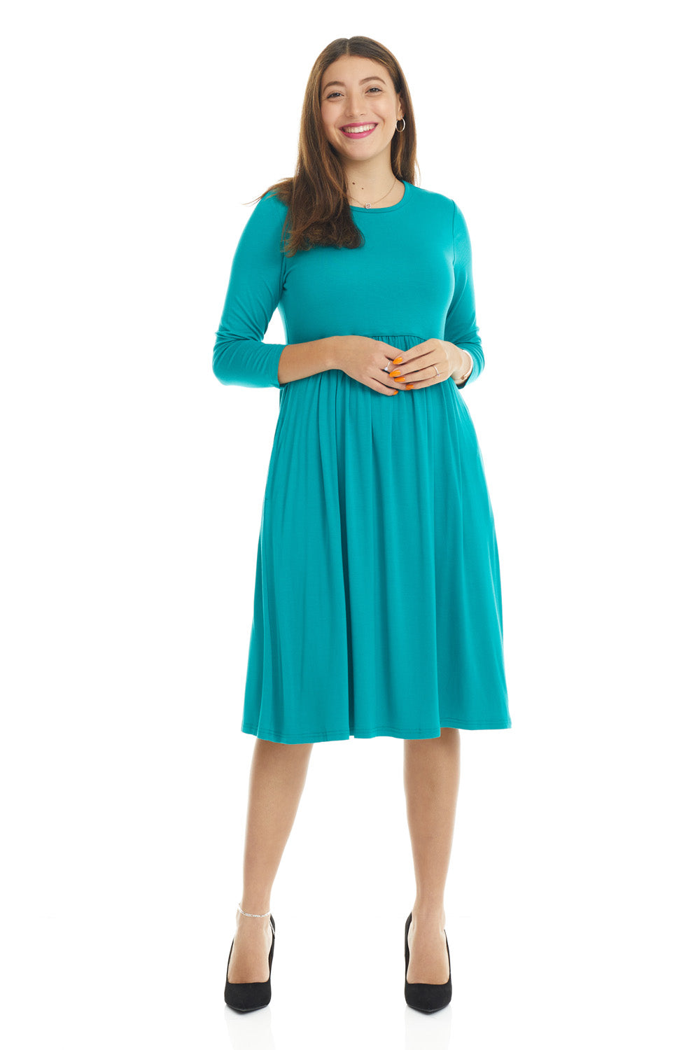 woman wearing a modest teal 3/4 sleeve knee length dress