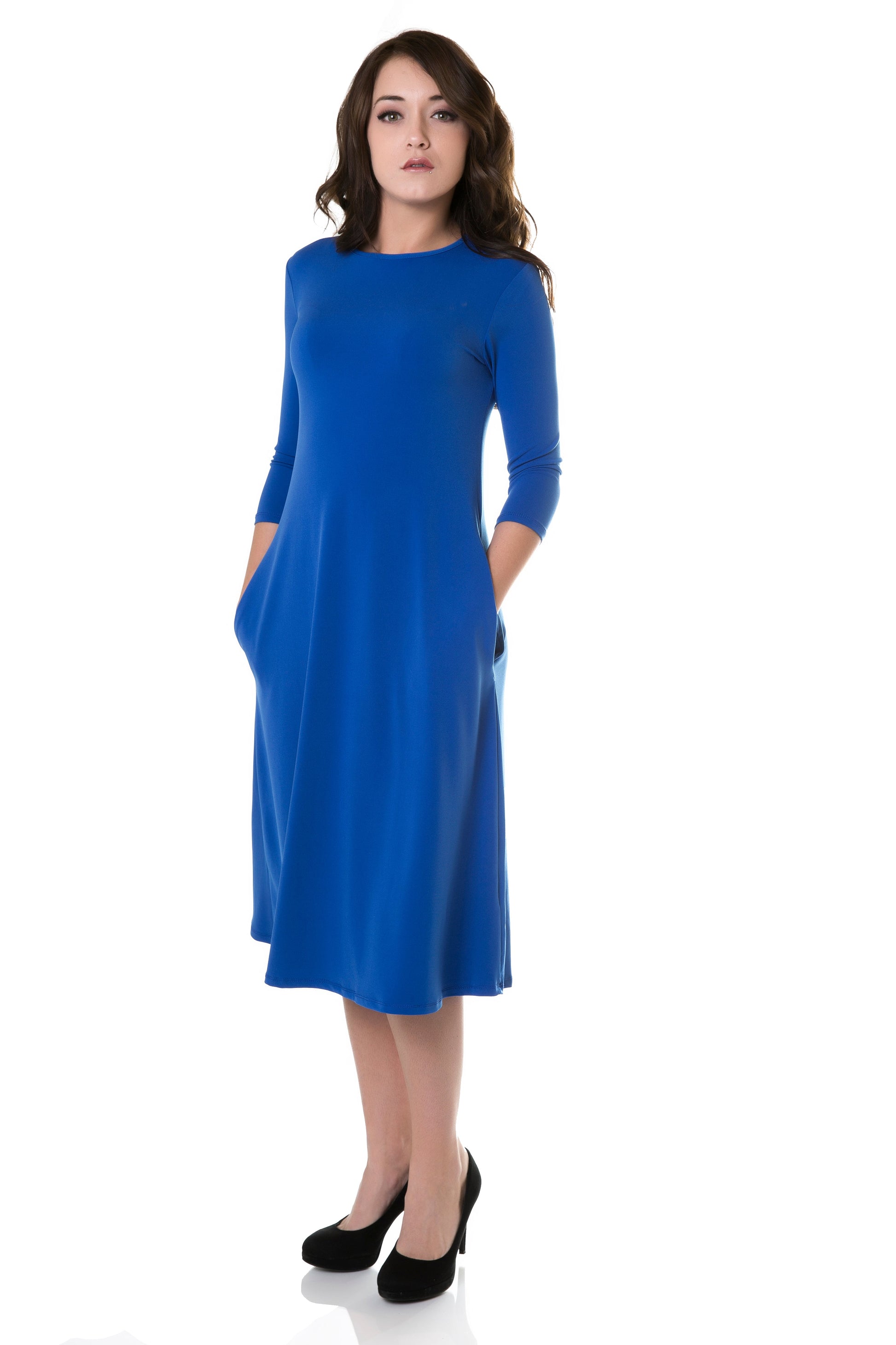 woman wearing cobalt blue flary 3/4 sleeve knee length modest dress