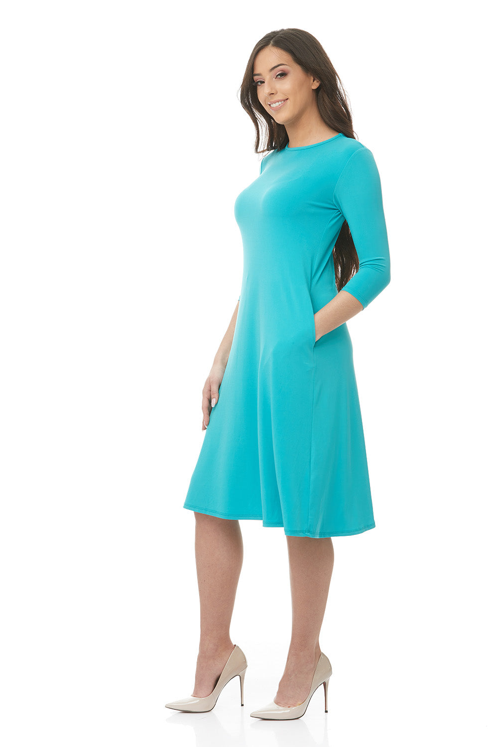 woman wearing teal turquoise  flary 3/4 sleeve knee length modest dress