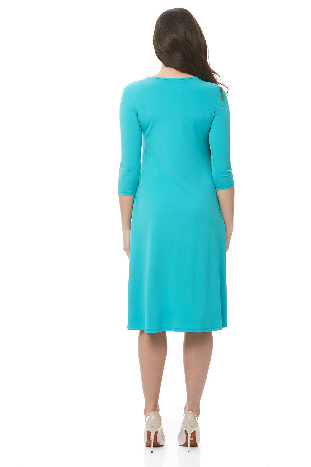 woman wearing turquoise flary 3/4 sleeve knee length modest dress