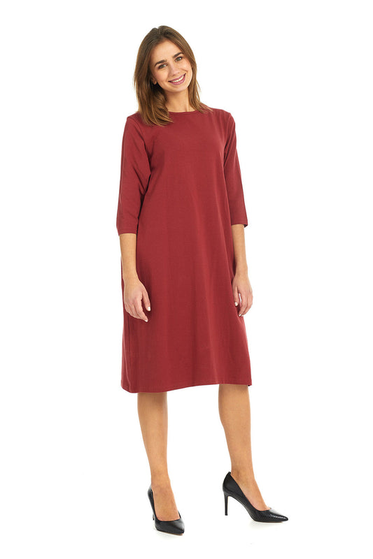 woman wearing a modest knee length, burgandy 3/4 sleeve cotton t-shirt dress