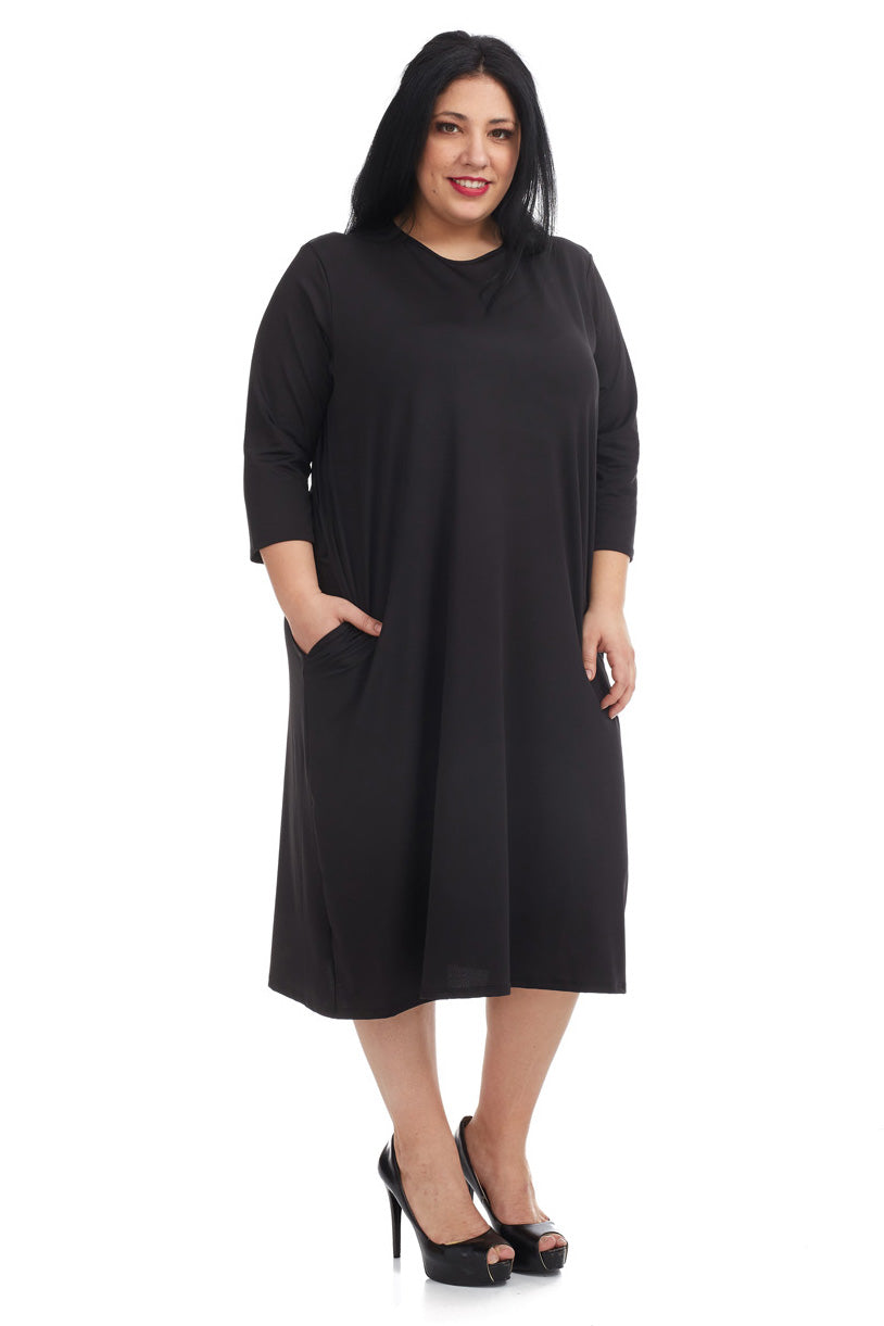 woman wearing a modest knee length, black 3/4 sleeve cotton t-shirt dress